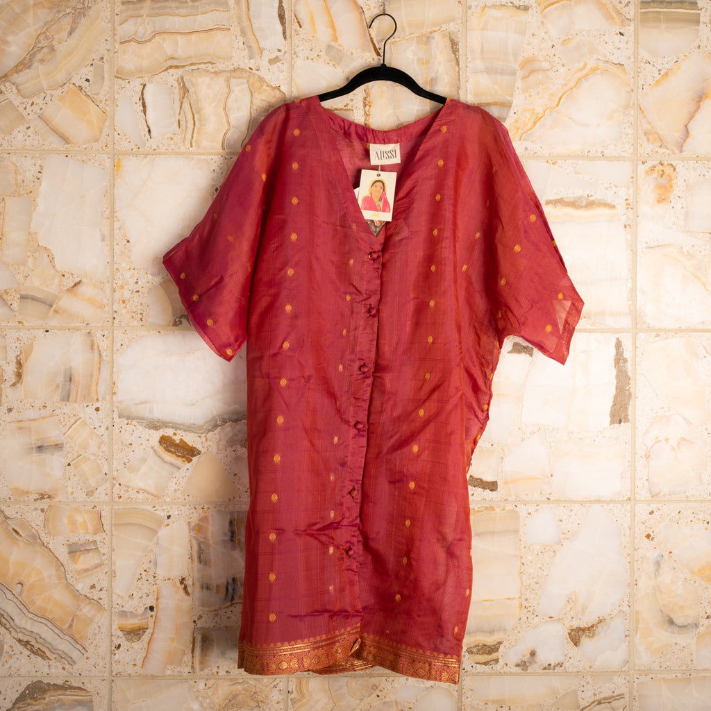 A wardrobe essential that works as a dress, shirt, duster, beach coverup, robe or nighty, and gives back to the women who make them by hand.  Made from upcycled saris; fabric content unknown.