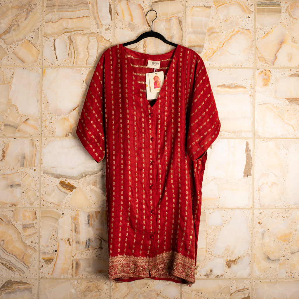 A wardrobe essential that works as a dress, shirt, duster, beach coverup, robe or nighty, and gives back to the women who make them by hand.  Made from upcycled saris; fabric content unknown.